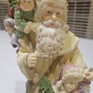 Festive Santa Claus Figurine with Children